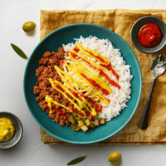 High protein cheeseburger bowl with rice and melted cheese